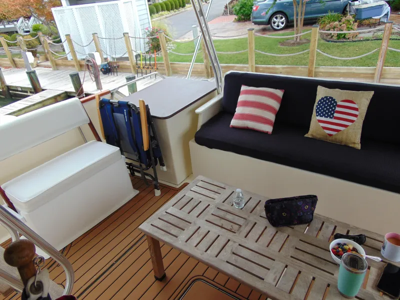 Slide: The Image of 1972 Hatteras Yachtfish docked at marina under clear blue sky. - 35