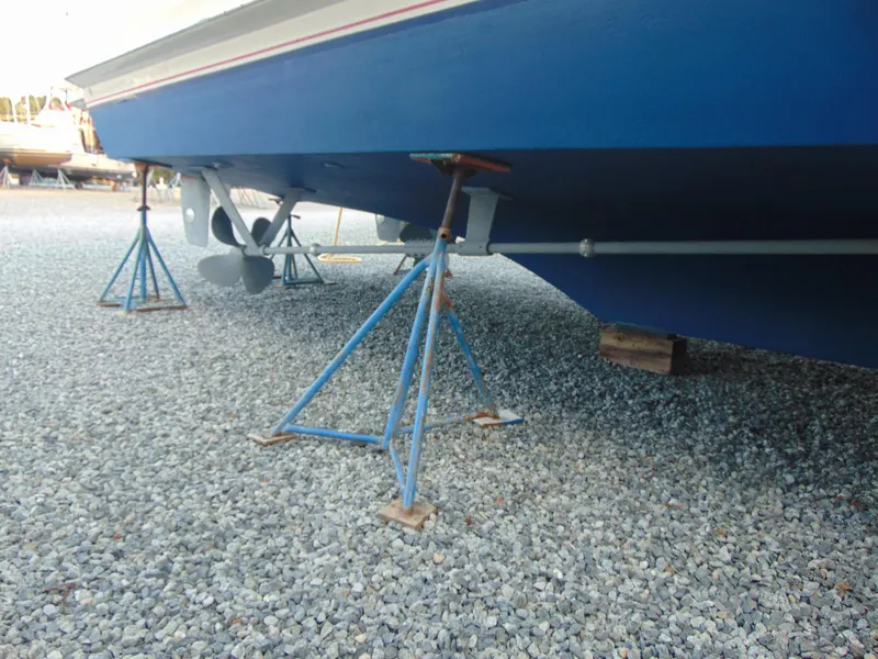 Slide: The Image of 1972 Hatteras Yachtfish docked at Chesapeake Beach, MD, under a partly cloudy sky. - 9