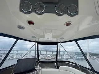 Slide: The Image of Interior view of 2007 Sea Ray 52 Sedan Bridge yacht with marina backdrop. - 14