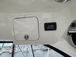 Slide: The Image of Interior view of 2007 Sea Ray 52 Sedan Bridge yacht with control panel. - 17