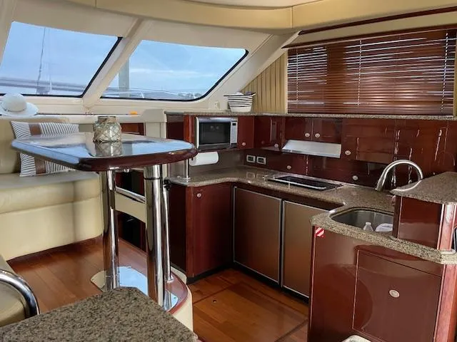 Slide: The Image of Luxurious interior of 2007 Sea Ray 52 Sedan Bridge yacht kitchen area. - 21