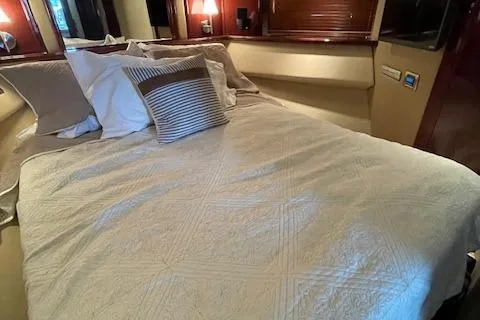 Slide: The Image of Luxurious bedroom interior of 2007 Sea Ray 52 Sedan Bridge yacht. - 33