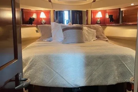 Slide: The Image of Luxurious bedroom interior of 2007 Sea Ray 52 Sedan Bridge yacht. - 34