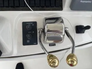 Slide: The Image of Throttle controls on a 2007 Sea Ray 52 Sedan Bridge yacht dashboard. - 39
