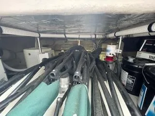 Slide: The Image of Engine room of 2007 Sea Ray 52 Sedan Bridge with hoses and equipment. - 47