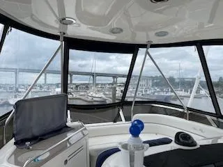 Slide: The Image of Interior view of 2007 Sea Ray 52 Sedan Bridge yacht with marina backdrop. - 6