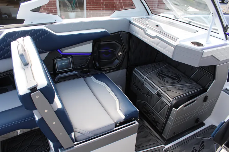 Slide: The Image of 2025 Tigé Ultré 25ZX boat interior with modern seating and sleek design. - 17