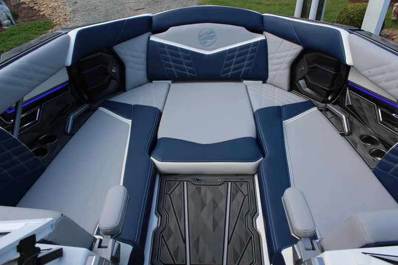 Slide: The Image of 2025 Tigé Ultré 25ZX boat interior with luxurious blue and gray seating. - 20