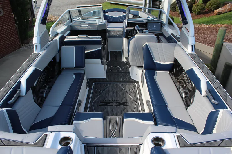 Slide: The Image of 2025 Tigé Ultré 25ZX boat interior with luxurious seating and modern design. - 9