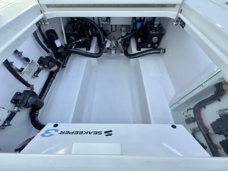 Slide: The Image of 2026 Mag Bay 38 CC boat interior with sleek helm and seating. - 13