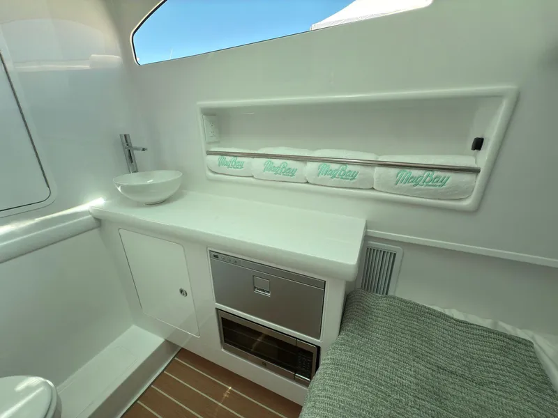 Slide: The Image of Luxurious 2026 Mag Bay 38 CC boat interior with elegant seating and modern design. - 23