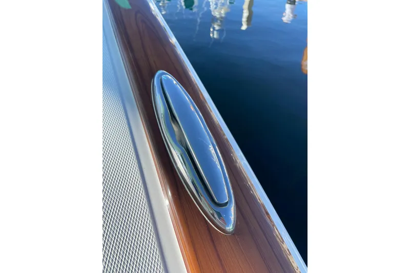 Slide: The Image of 2026 Mag Bay 38 CC boat with sleek chrome details and modern design. - 34