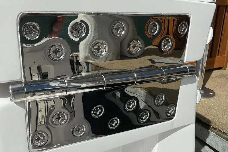 Slide: The Image of Close-up of a polished metal fixture on a 2026 Mag Bay 38 CC boat. - 35