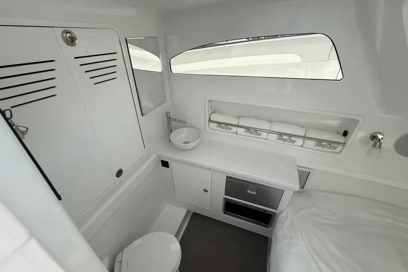 Slide: The Image of 2026 Mag Bay 38 CC cabin interior with modern amenities and sleek design. - 39