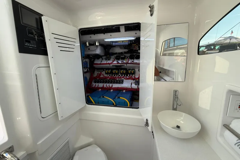 Slide: The Image of Electrical panel and sink inside 2026 Mag Bay 38 CC boat cabin. - 40