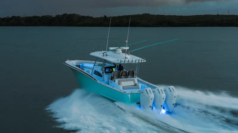 Slide: The Image of 2026 Mag Bay 38 CC boat docked at marina, showcasing sleek design and modern features. - 5