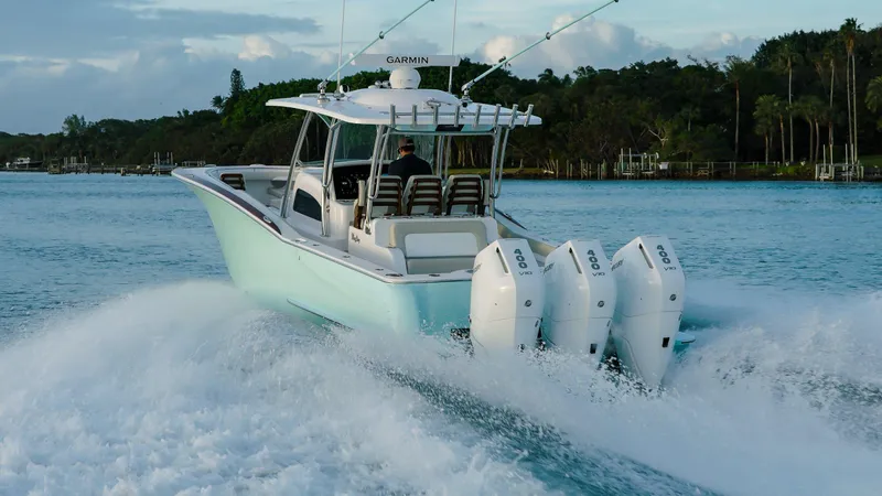 Slide: The Image of 2026 Mag Bay 38 CC boat with dual Mercury Verado engines docked. - 7