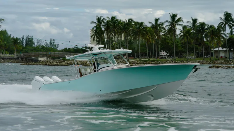 Slide: The Image of 2026 Mag Bay 38 CC boat deck with seating and twin Mercury engines. - 9