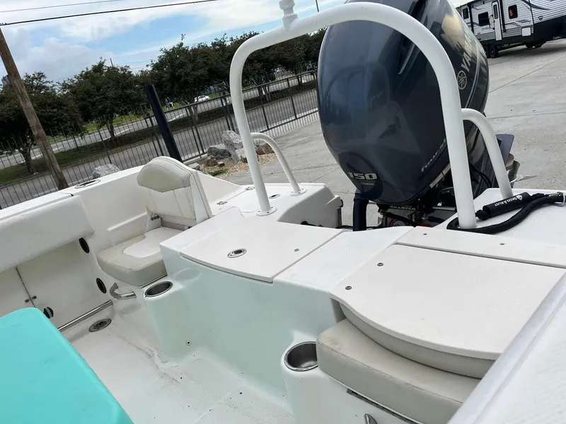 Slide: The Image of 2016 Robalo R200 Center Console boat interior with seating and outboard motor. - 10
