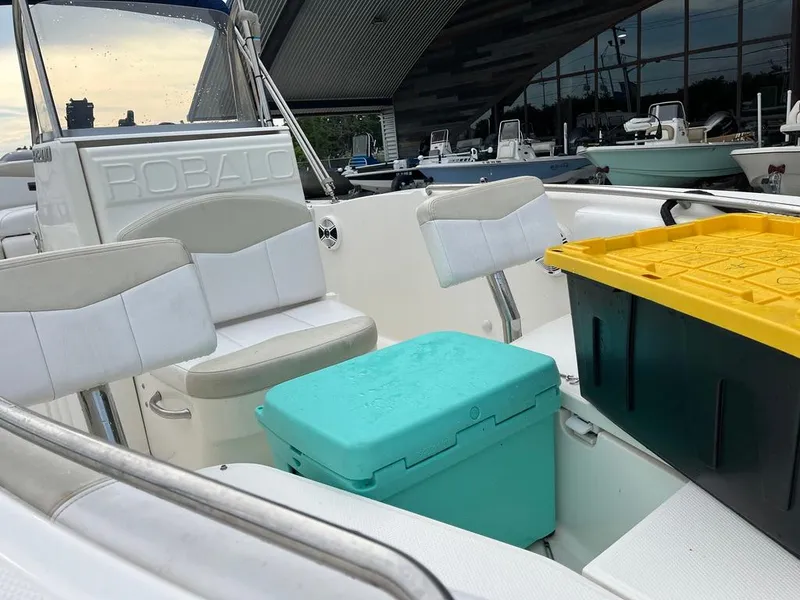 Slide: The Image of 2016 Robalo R200 Center Console boat interior with seating and storage boxes. - 15