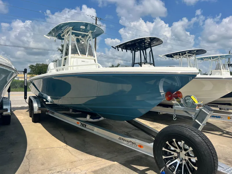 Slide: The Image of 2025 Pathfinder 2600 TRS boat on trailer under blue sky. - 1