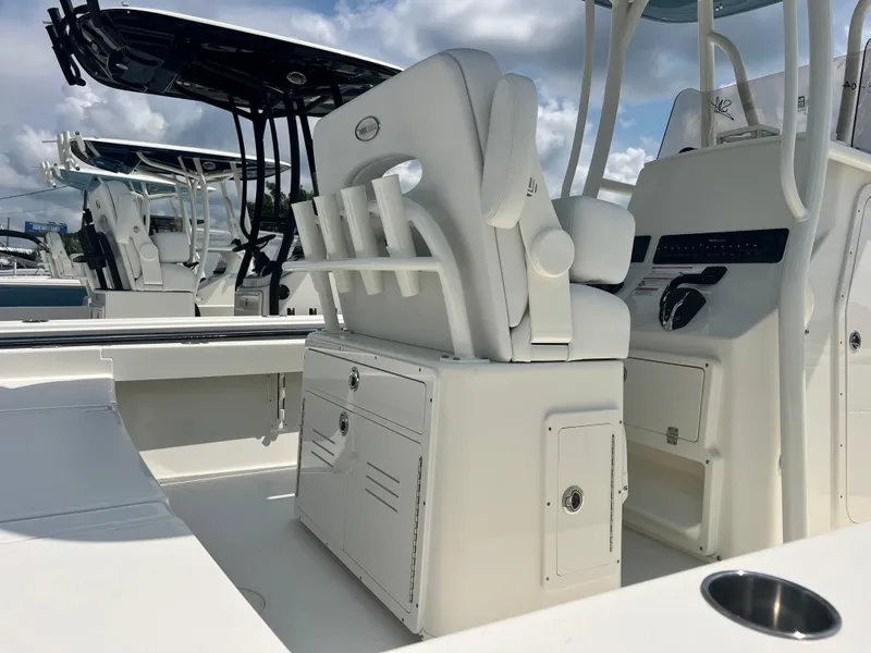 Slide: The Image of 2025 Pathfinder 2600 TRS boat interior with white seating and storage compartments. - 10