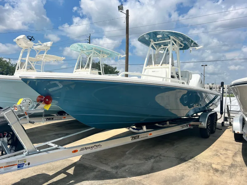 Slide: The Image of 2025 Pathfinder 2600 TRS boat on trailer under blue sky. - 7