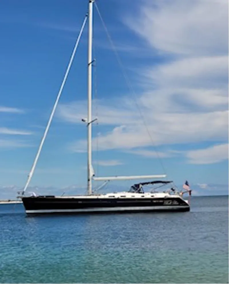 Slide: The Image of 2007 Beneteau Oceanis Clipper 523 sailboat on calm sea under clear blue sky. - 0