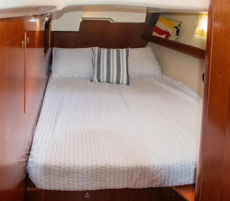 Slide: The Image of Cozy cabin interior of 2007 Beneteau Oceanis Clipper 523 yacht with comfortable bedding. - 10