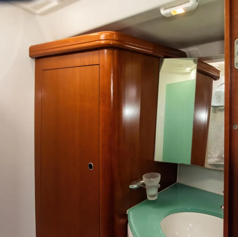 Slide: The Image of Interior of 2007 Beneteau Oceanis Clipper 523 bathroom with wooden cabinet and sink. - 17