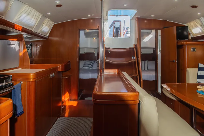 Slide: The Image of Luxurious interior of 2007 Beneteau Oceanis Clipper 523 yacht with wood finish and cozy cabins. - 22
