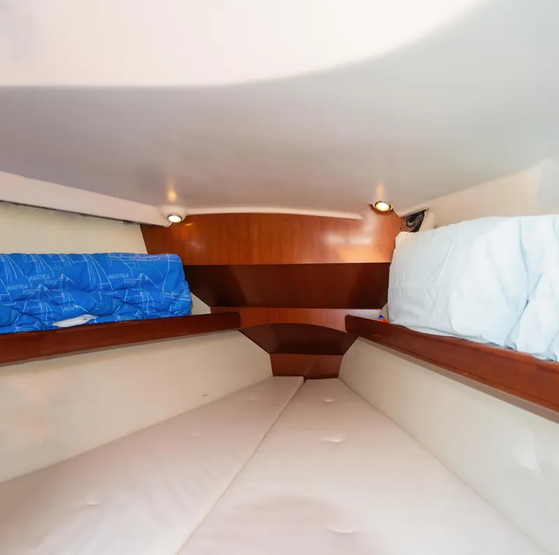 Slide: The Image of Interior cabin of 2007 Beneteau Oceanis Clipper 523 yacht, featuring cozy sleeping area. - 39