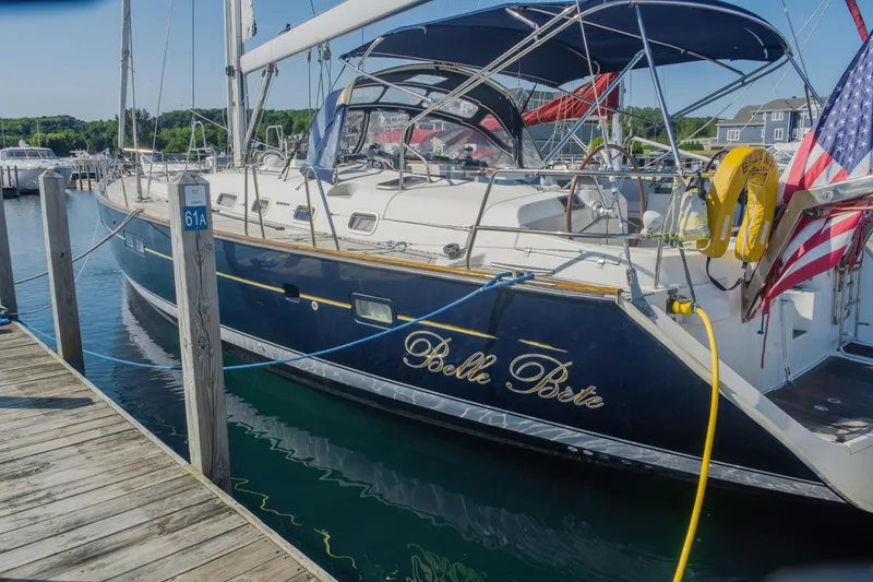 Slide: The Image of Beneteau Oceanis Clipper 523 sailboat docked, 2007 model, with blue hull and canopy. - 44