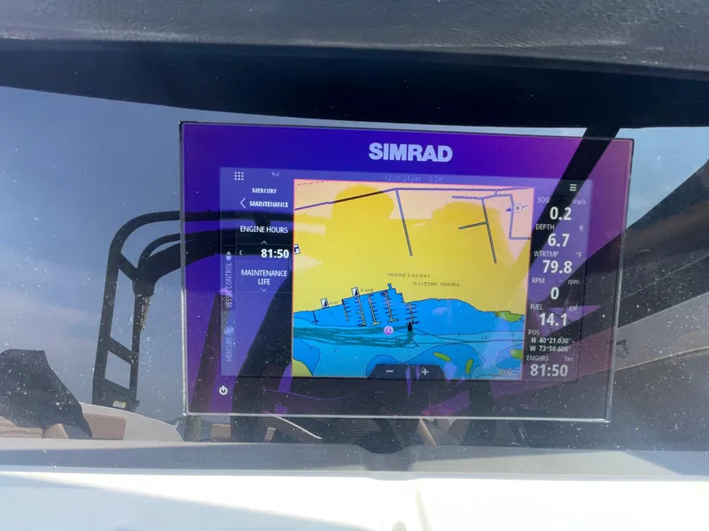 Slide: The Image of Simrad navigation display on 2023 Sea Ray SPX 230 Outboard boat. - 13