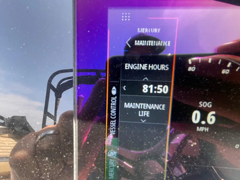Slide: The Image of 2023 Sea Ray SPX 230 Outboard dashboard showing engine hours and speed. - 14