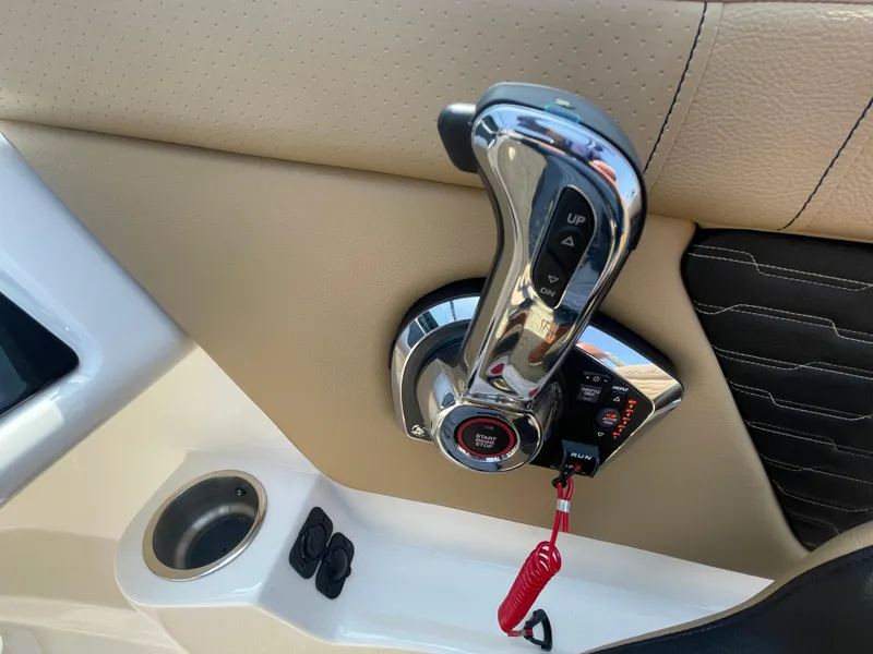 Slide: The Image of Throttle control of 2023 Sea Ray SPX 230 Outboard boat, featuring start/stop button. - 18