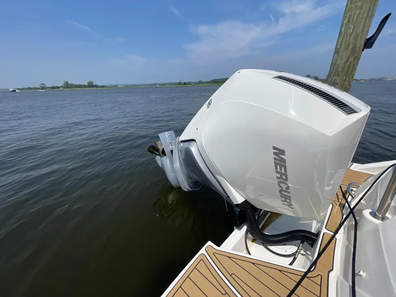Slide: The Image of 2023 Sea Ray SPX 230 Outboard with Mercury engine on calm water. - 33