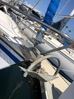 Slide: The Image of 1984 Hunter 31 sailboat with anchor, docked in marina. - 23