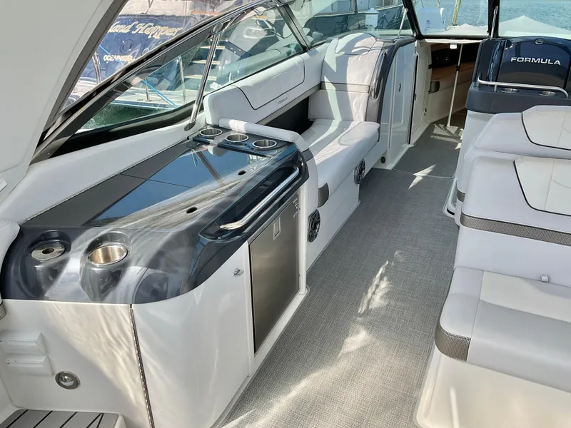 Slide: The Image of 2022 Formula 350 Crossover Bowrider I/O interior with sleek seating and modern amenities. - 12