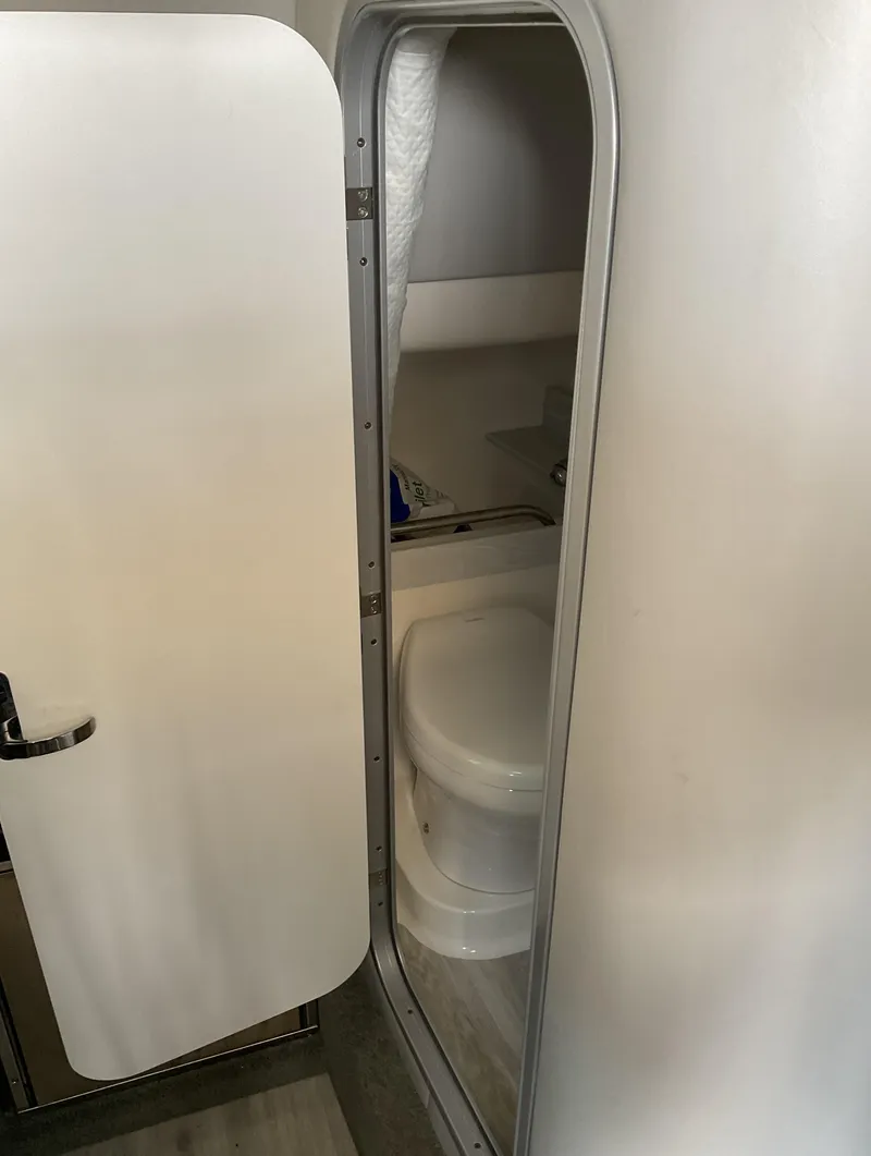 Slide: The Image of 2022 Formula 350 Crossover Bowrider I/O bathroom interior with compact design. - 19