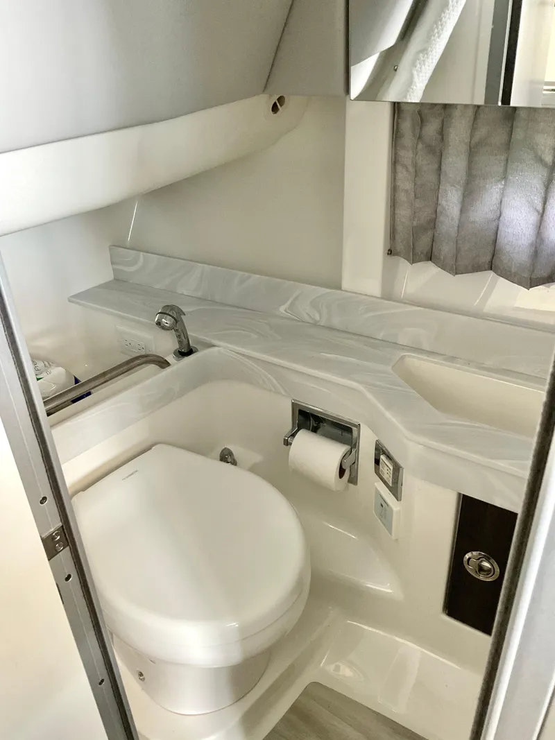 Slide: The Image of 2022 Formula 350 Crossover Bowrider I/O bathroom with modern fixtures and sleek design. - 20