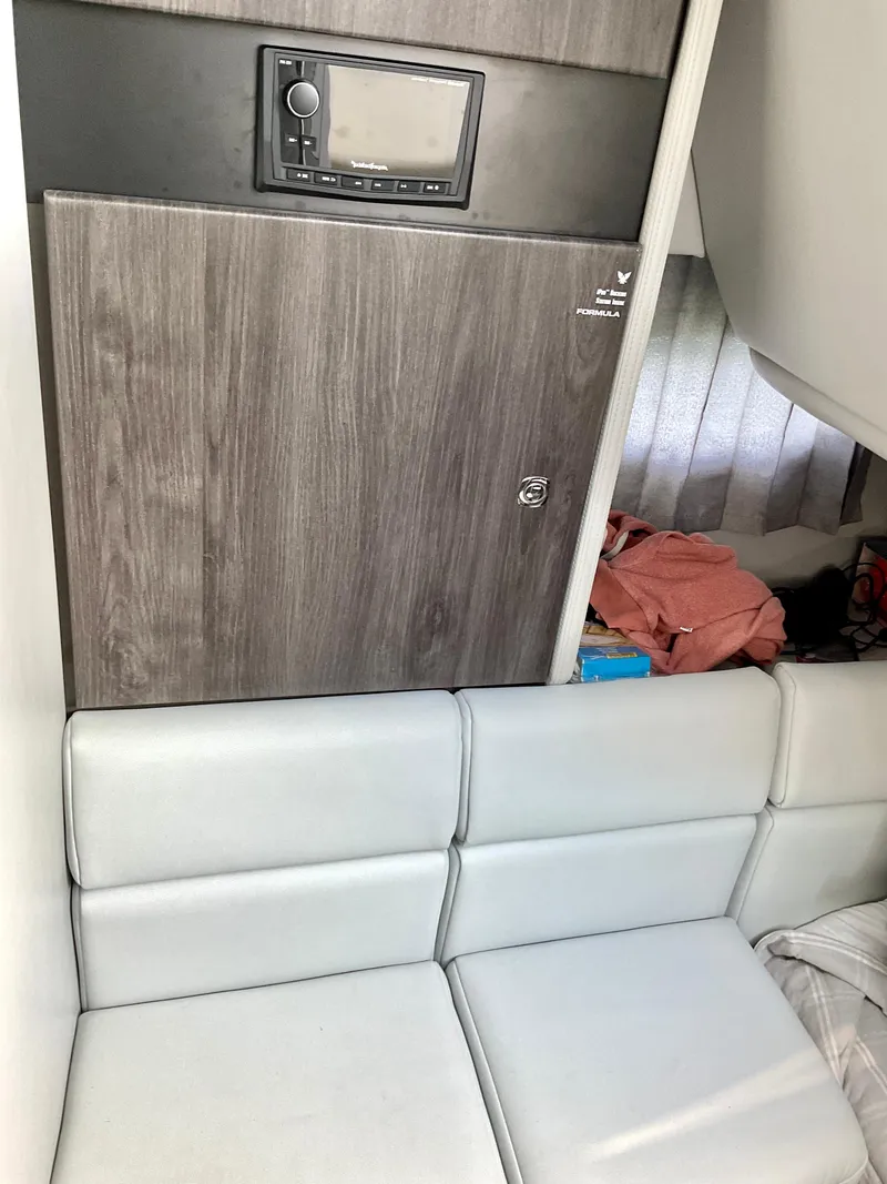 Slide: The Image of Interior of 2022 Formula 350 Crossover Bowrider I/O with modern seating and storage. - 22