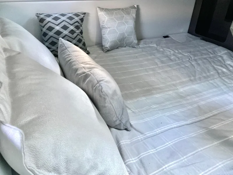 Slide: The Image of Interior cabin bed with pillows in 2022 Formula 350 Crossover Bowrider I/O. - 25