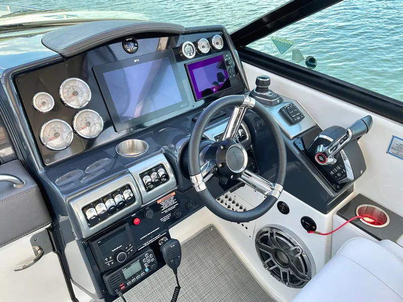 Slide: The Image of 2022 Formula 350 Crossover Bowrider I/O dashboard with modern controls and navigation screens. - 32