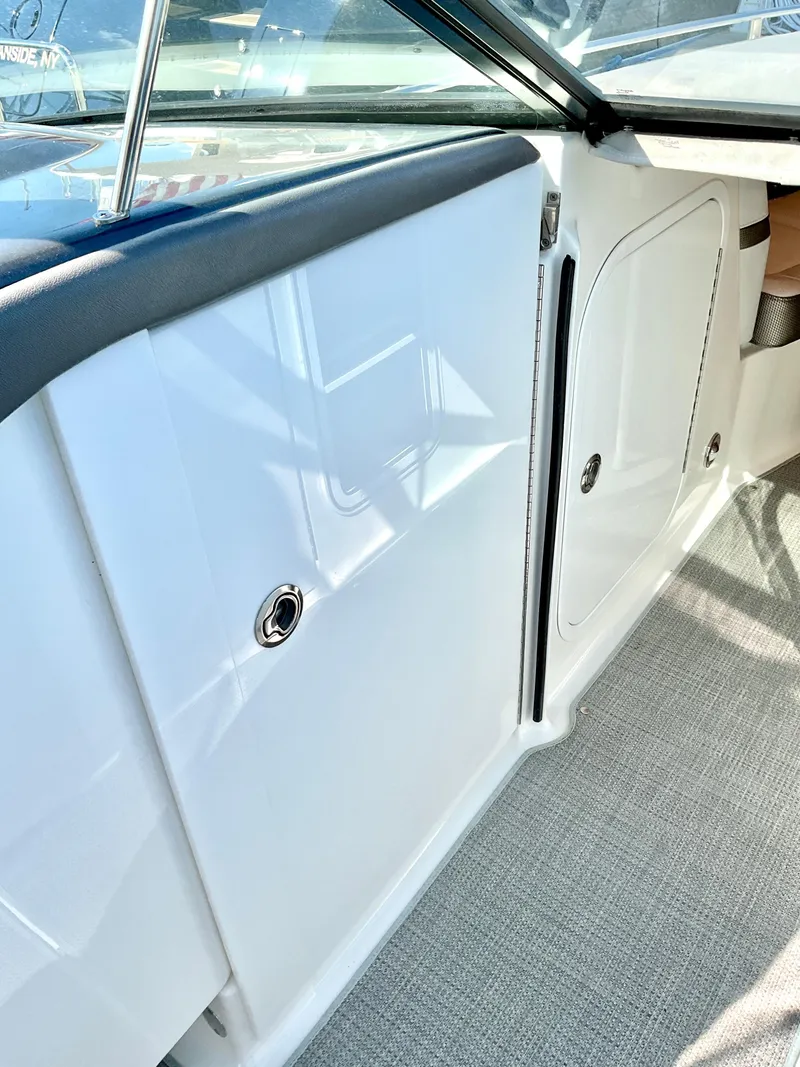 Slide: The Image of 2022 Formula 350 Crossover Bowrider I/O interior, sleek white paneling and modern design. - 34