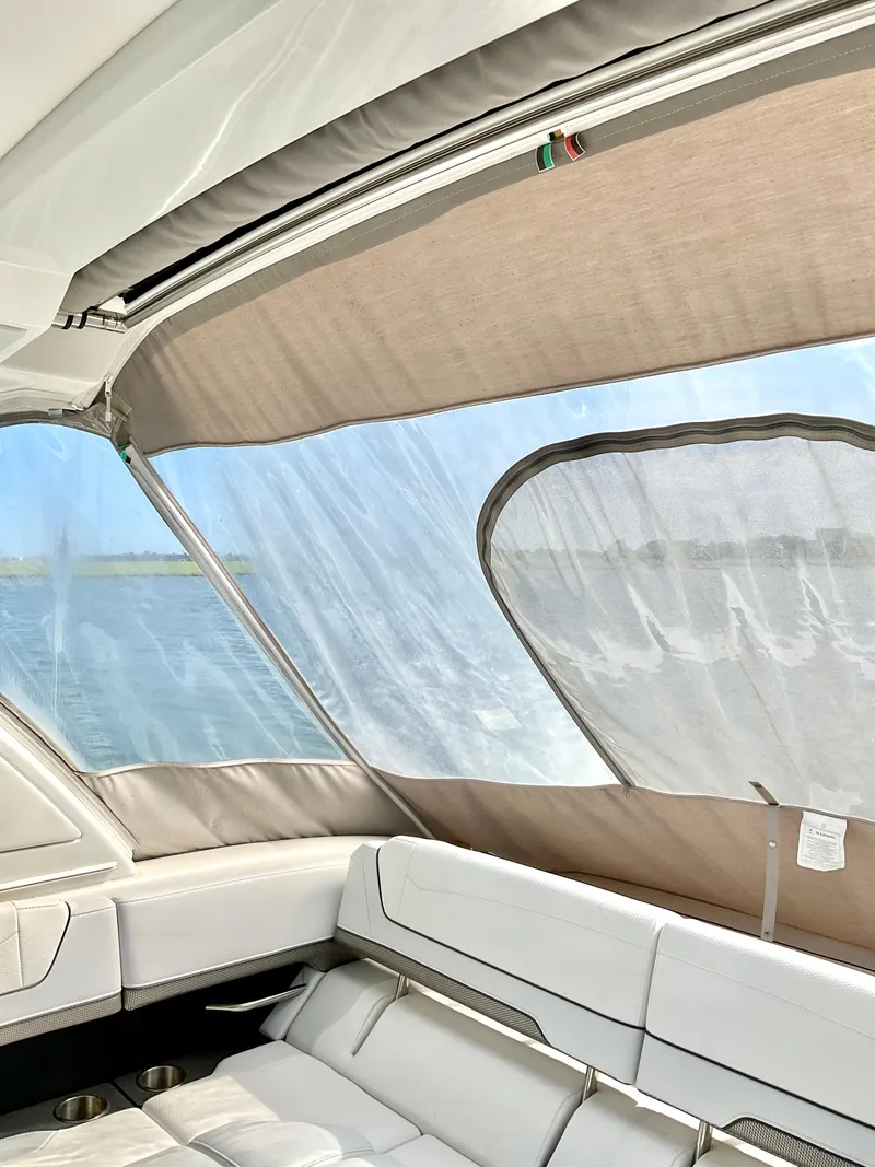 Slide: The Image of Interior view of 2022 Formula 350 Crossover Bowrider I/O with water backdrop. - 49