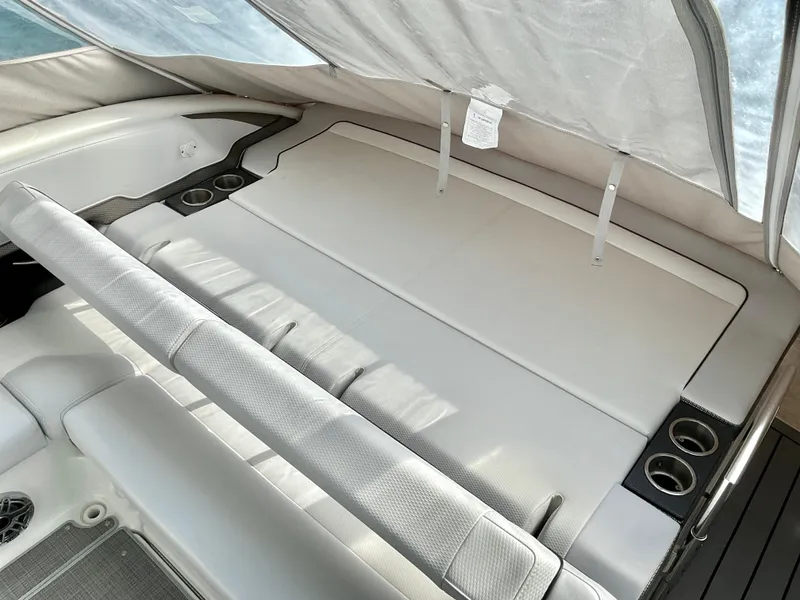 Slide: The Image of 2022 Formula 350 Crossover Bowrider I/O interior with spacious seating and cup holders. - 50