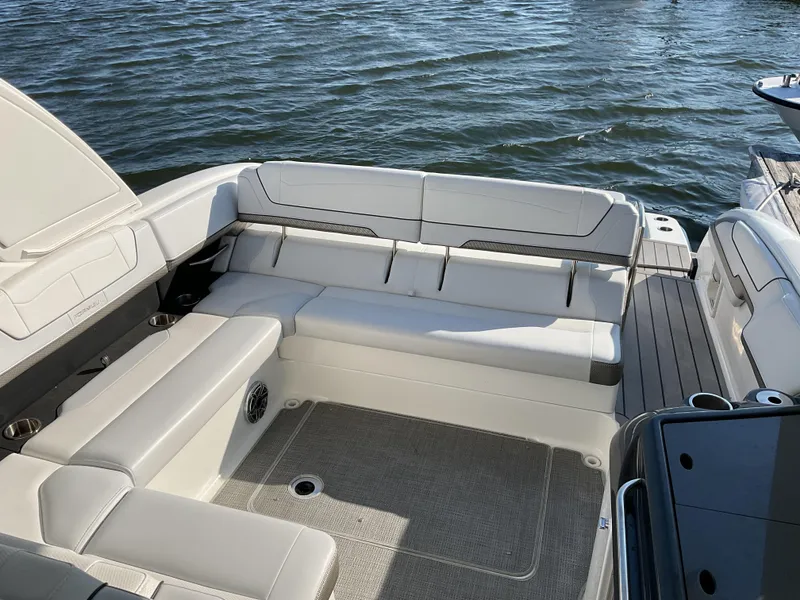 Slide: The Image of 2022 Formula 350 Crossover Bowrider I/O with spacious seating on calm waters. - 6