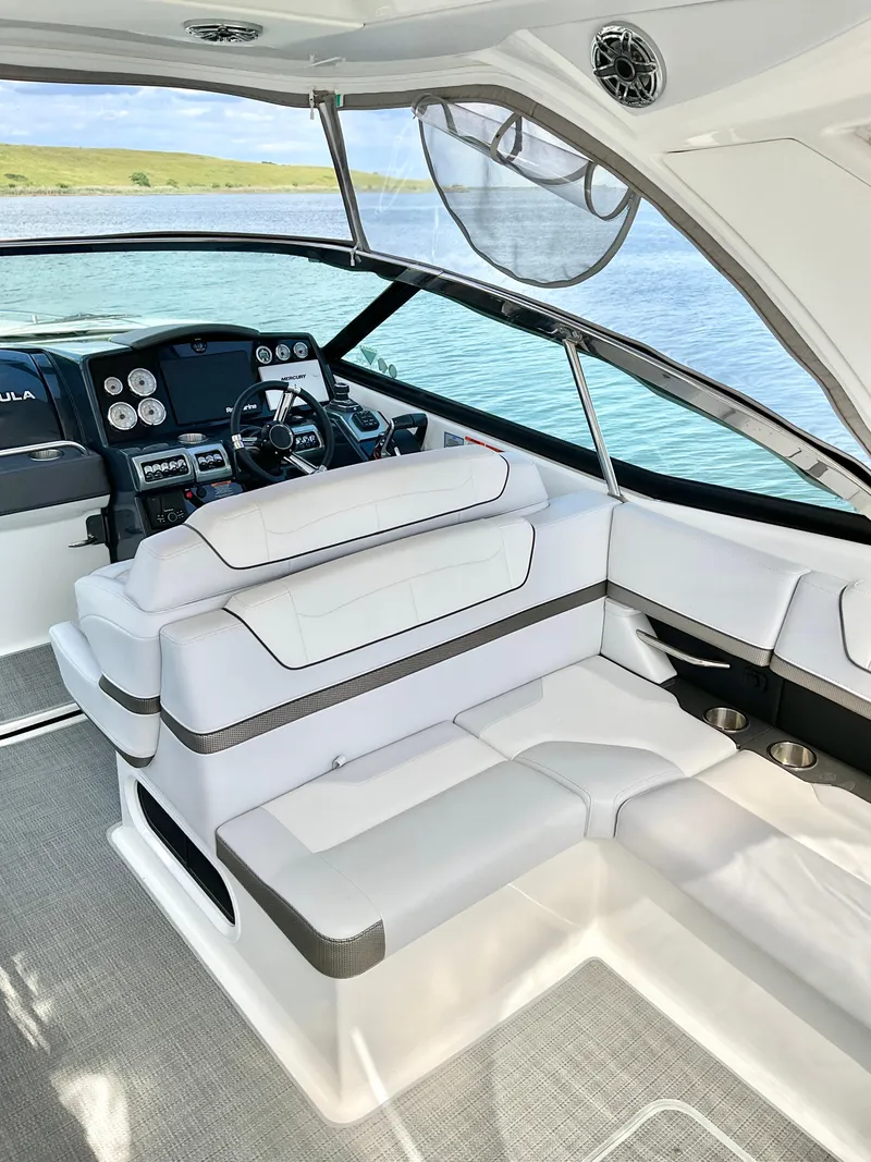 Slide: The Image of 2022 Formula 350 Crossover Bowrider I/O interior with sleek seating and modern dashboard. - 9
