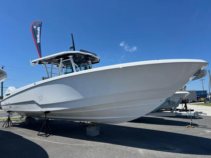 The Image of 2025 Wellcraft 352 Fisherman boat displayed outdoors under clear blue sky. - 0